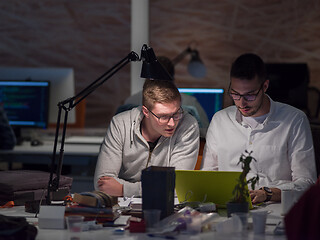 Image showing designers in the night startup office