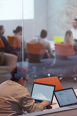 Image showing businesswoman using a laptop in startup office