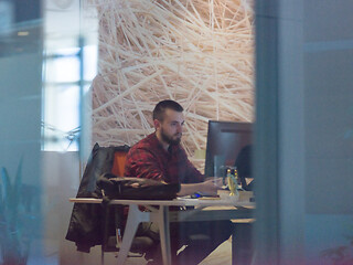 Image showing businessman working using a computer in startup office