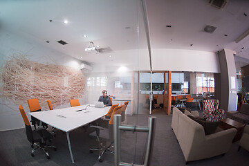 Image showing businessman working using a laptop in startup office