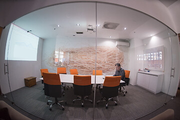 Image showing businessman working using a laptop in startup office