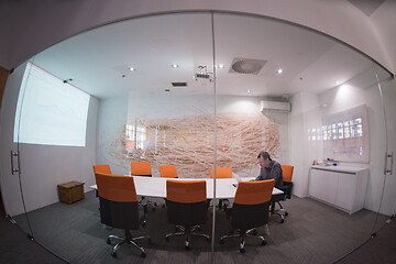 Image showing businessman working using a laptop in startup office