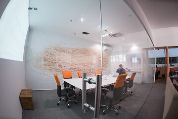 Image showing businessman working using a laptop in startup office