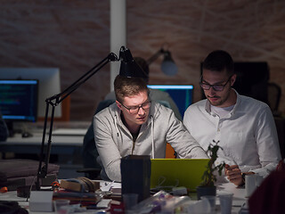 Image showing designers in the night startup office