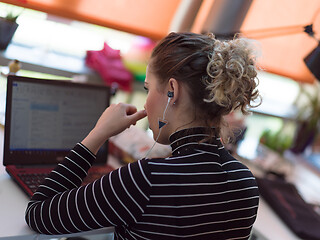 Image showing businesswoman using a laptop in startup office