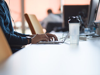 Image showing businessman working using a laptop in startup office