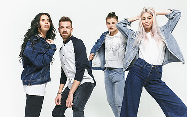 Image showing Group of smiling friends in fashionable jeans