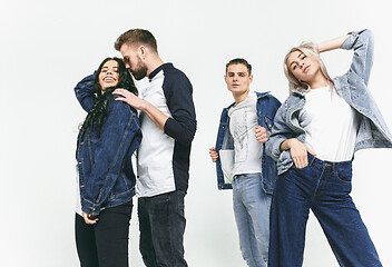 Image showing Group of smiling friends in fashionable jeans