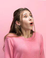 Image showing The woman screaming with open mouth isolated on pink background, concept face emotion