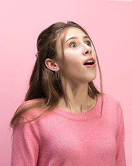 Image showing The woman screaming with open mouth isolated on pink background, concept face emotion