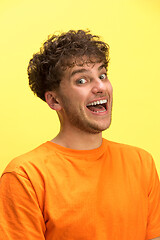 Image showing The man screaming with open mouth isolated on yellow background, concept face emotion