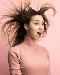 Image showing The woman screaming with open mouth isolated on pink background, concept face emotion