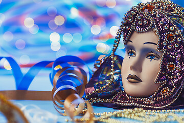 Image showing Traditional female carnival venetian mask on bokeh background. Masquerade, Venice, Mardi Gras, Brazil concept