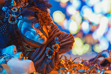 Image showing Traditional female carnival venetian mask on bokeh background. Masquerade, Venice, Mardi Gras, Brazil concept