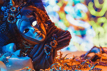 Image showing Traditional female carnival venetian mask on bokeh background. Masquerade, Venice, Mardi Gras, Brazil concept