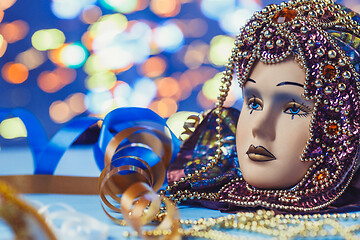 Image showing Traditional female carnival venetian mask on bokeh background. Masquerade, Venice, Mardi Gras, Brazil concept