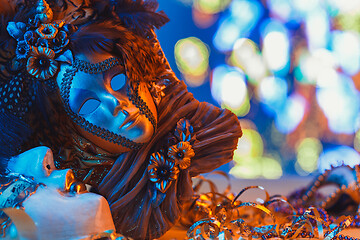 Image showing Traditional female carnival venetian mask on bokeh background. Masquerade, Venice, Mardi Gras, Brazil concept