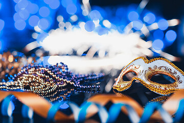 Image showing Traditional female carnival venetian mask on bokeh background. Masquerade, Venice, Mardi Gras, Brazil concept