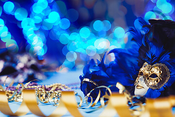 Image showing Traditional female carnival venetian mask on bokeh background. Masquerade, Venice, Mardi Gras, Brazil concept