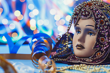 Image showing Traditional female carnival venetian mask on bokeh background. Masquerade, Venice, Mardi Gras, Brazil concept