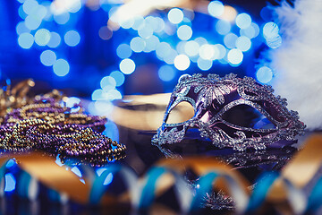 Image showing Traditional female carnival venetian mask on bokeh background. Masquerade, Venice, Mardi Gras, Brazil concept