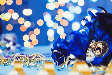 Image showing Traditional female carnival venetian mask on bokeh background. Masquerade, Venice, Mardi Gras, Brazil concept