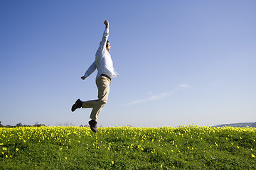 Image showing man jumping high to sucess