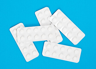 Image showing Pill strips on blue on background