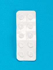 Image showing Pill strip on blue on background