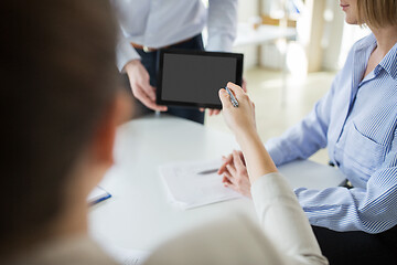 Image showing close up of business team with tablet pc at office