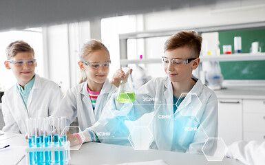 Image showing kids with test tubes studying chemistry at school