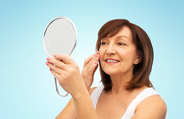 Image showing portrait of smiling senior woman with mirror