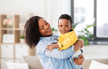 Image showing happy african american mother with baby at home