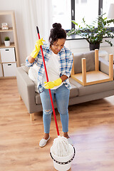 Image showing african woman or housewife cleaning floor at home