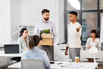 Image showing fired sad male office worker leaving