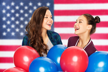 Image showing teenage girls with balloons over american flag