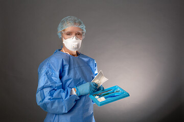 Image showing Medical surgeon holding tools for operation