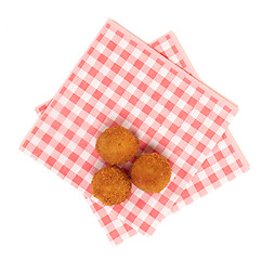 Image showing Dutch traditional snack bitterbal on a red and white napkin