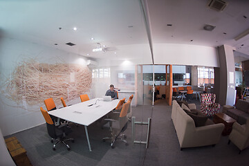 Image showing businessman working using a laptop in startup office