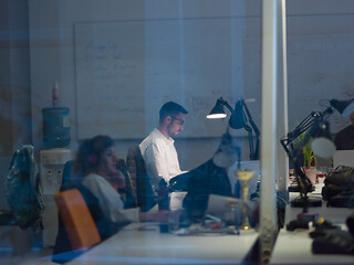 Image showing businessman working using a laptop in startup office