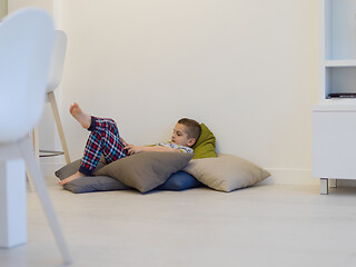 Image showing little boy playing games on tablet computers