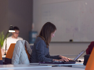 Image showing businesswoman using a laptop in startup office