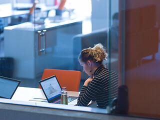 Image showing businesswoman using a laptop in startup office