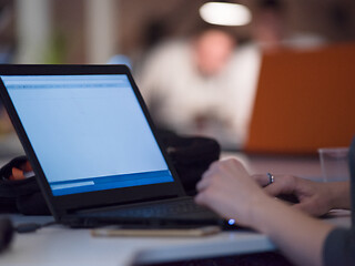 Image showing businesswoman using a laptop in startup office