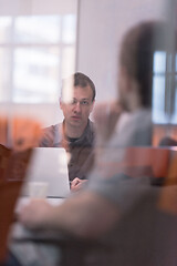 Image showing businessman working using a laptop in startup office