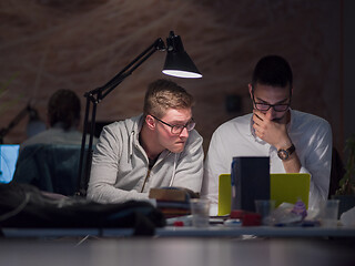 Image showing designers in the night startup office