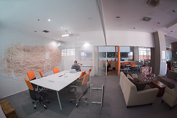 Image showing businessman working using a laptop in startup office