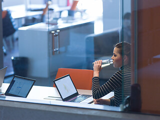 Image showing businesswoman using a laptop in startup office