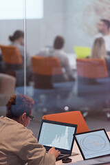 Image showing businesswoman using a laptop in startup office