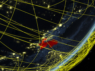 Image showing Tajikistan on dark Earth with network